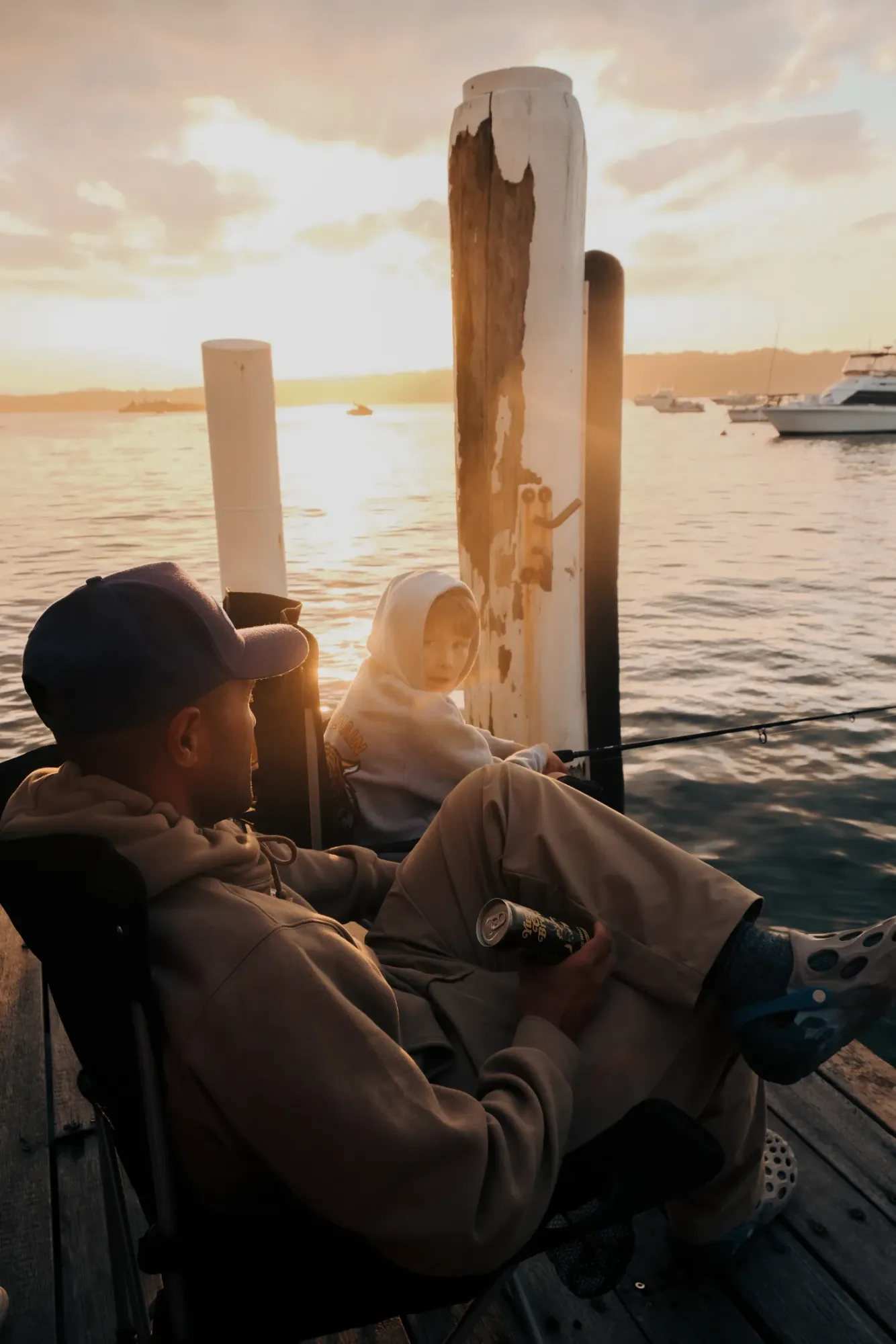 Cold brew in hand on the wharf at sunset