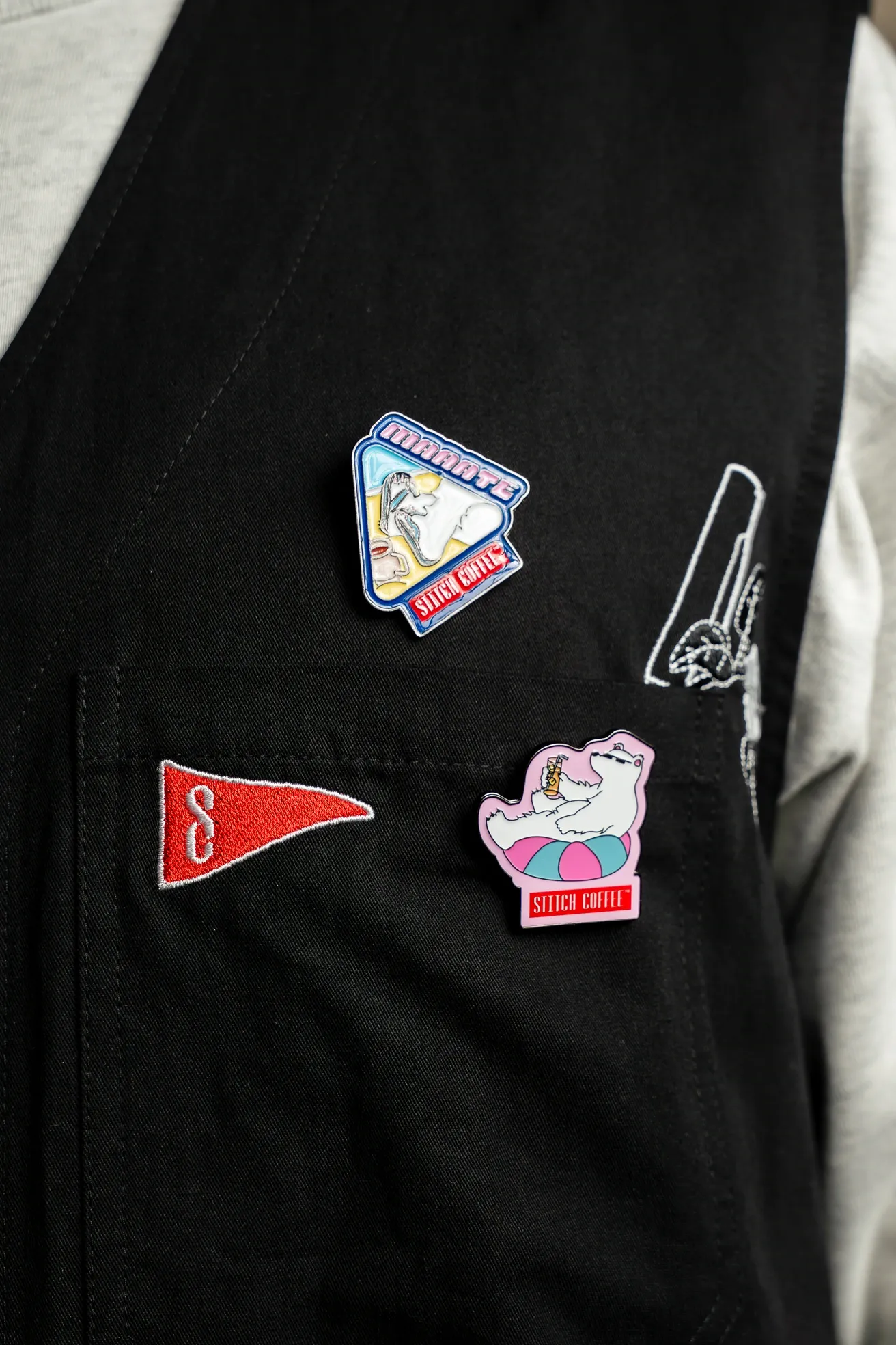 Enamel pins and embroidered pennant